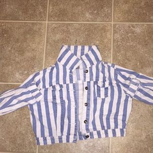 A colored , blue and white jean jacket.